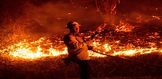 Thousands evacuated as wildfires ravage homes near Los Angeles