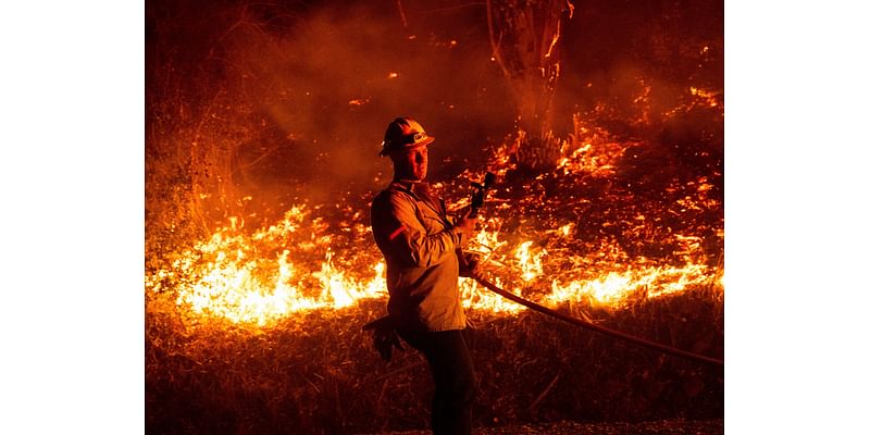 Thousands evacuated as wildfires ravage homes near Los Angeles