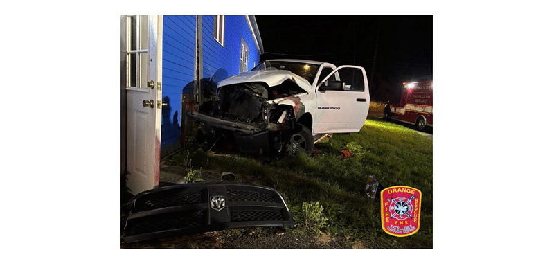 Driver uninjured after truck crashes into home in Orange