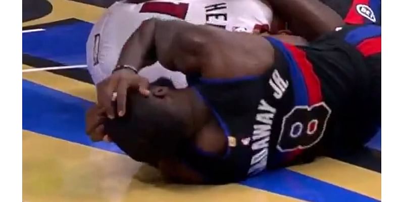 Pistons' Tim Hardaway Jr leaves game in wheelchair after slamming head on court in worrying scenes