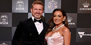 Eyes up here, please! Nathan Buckley's girlfriend Brodie Ryan shows off her ample cleavage in plunging gown at the Brownlow Medal 2024