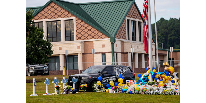 Mom of suspect in Georgia school shooting indicted and is accused of taping a parent to a chair