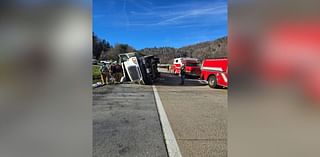 Tractor-trailer carrying flood debris overturns on I-26 entrance ramp in Erwin