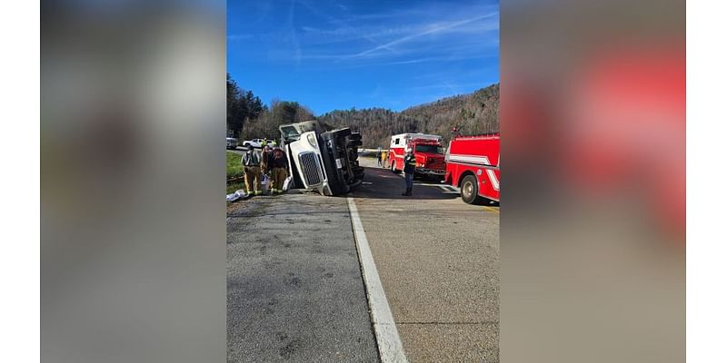 Tractor-trailer carrying flood debris overturns on I-26 entrance ramp in Erwin