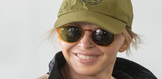 Kylie Minogue tries to go incognito under a large coat and hat while touching down in Sydney as pop star prepares to announce Grammy nominees