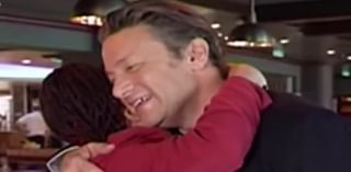 Jamie Oliver embraces Aboriginal advocate in touching moment during Narelda Jacobs interview after he pulled 'offensive' children's book from shelves: 'It's been very painful'