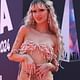 Pop star Peach PRC almost suffers a wardrobe malfunction as her crochet outfit perilously hangs off her slender frame at the 2024 ARIA Awards