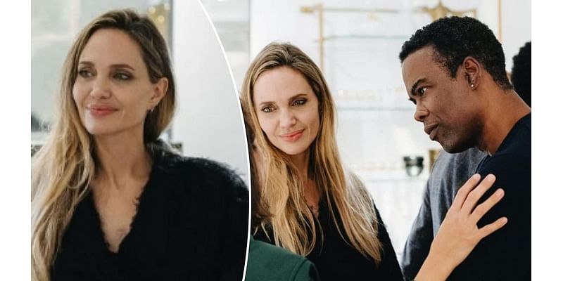 Angelina Jolie is seen chatting up Brad Pitt's friend Chris Rock at her NYC fashion event