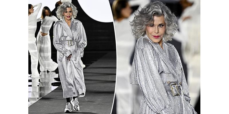 Jane Fonda struts her stuff for L’Oréal Paris runway in sparkling trench coat and sneakers