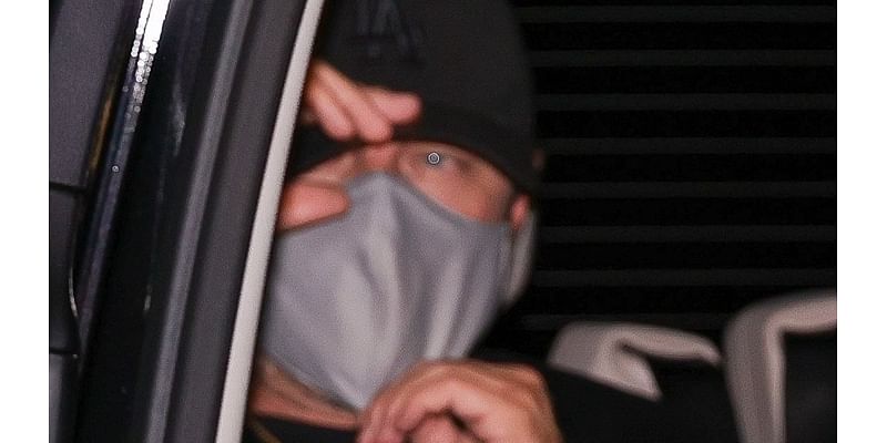 Leonardo DiCaprio covers up in a face mask as he attends star-studded Paris Fashion Week party at Costes Hotel with girlfriend Vittoria Ceretti and model Neelam Gill