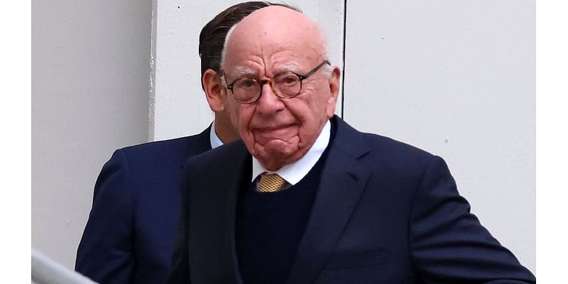 Media mogul Rupert Murdoch is all smiles as he enters court with his heir apparent Lachlan on second day of battle over News Corp empire