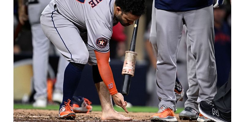 Jose Altuve tossed for removing cleat, sock in wild Astros win