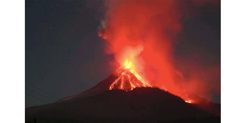 Pictured: Volcano erupts in Bali spewing five-mile ash cloud