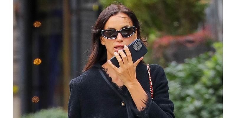 Irina Shayk is chic in Chanel as she wraps up in a faux fur-trimmed coat and totes $10K handbag during a dog walk in NYC - days after her sizzling Victoria's Secret runway appearance