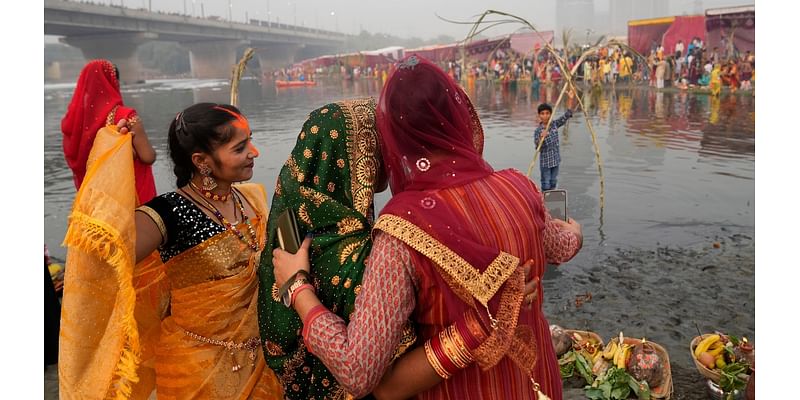 AP PHOTOS: Tens of thousands of Hindu devotees flock to rivers for prayers to the sun god