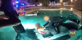 VIDEO: Officer jumps into action to save man after car plunges into pool