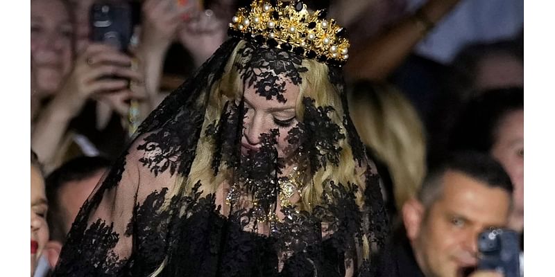 Madonna makes veiled entrance to Dolce&Gabbana for show celebrating her 1990s heyday