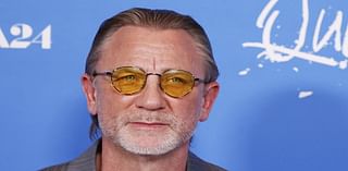 Daniel Craig appears to be morphing into U2's Bono with yellow sunglasses and slicked-back hair as he attends Queer premiere in LA