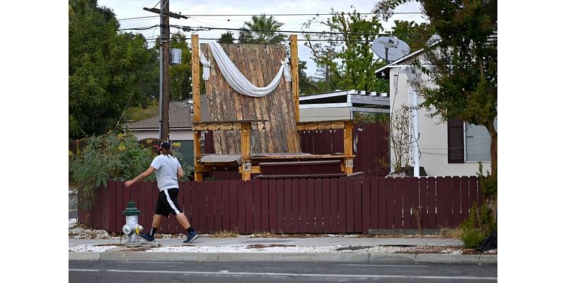 A wooden chair in California is as tall as a house. It’s part of a teary love story