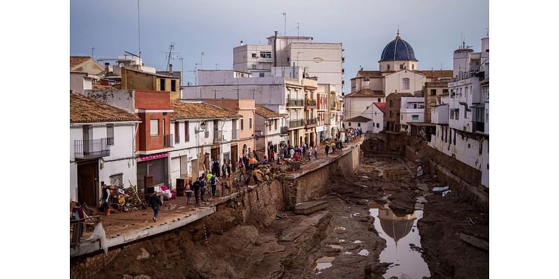 Crashing waves in a hilltop village, a night of terror from Spain’s floods