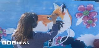 Mural of foxes painted at Pinhoe station