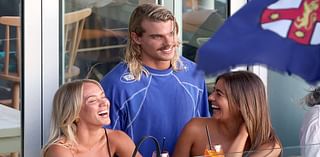 Letting his hair down! AFL heartthrob Bailey Smith downs shots at a Bondi bar and chats up two attractive women after announcing his trade request from Western Bulldogs