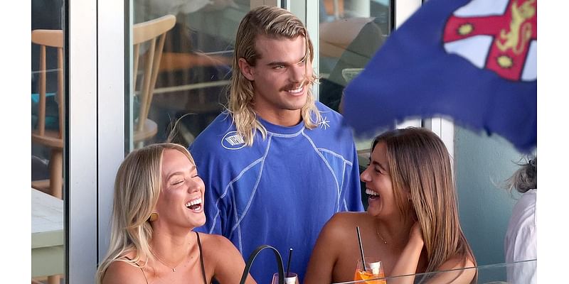 Letting his hair down! AFL heartthrob Bailey Smith downs shots at a Bondi bar and chats up two attractive women after announcing his trade request from Western Bulldogs