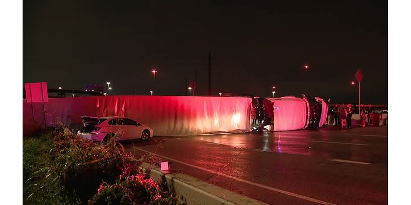 Overturned 18-wheeler loaded with Amazon packages shuts down I-35 after flash floods