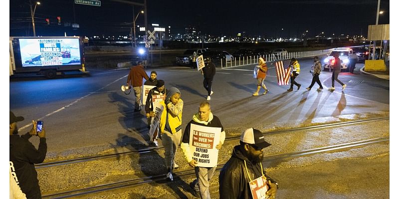 Dockworkers go on strike, snarling traffic at East and Gulf Coast ports