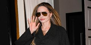 Angelina Jolie cuts a typically chic figure in a sleek black coat and shades as she steps out in New York following a Q&A about new film Maria