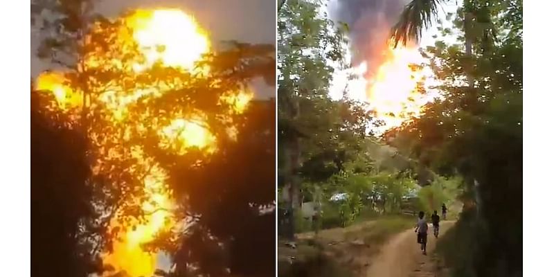 Frightening moment 'mud volcano' erupts in towering flame as terrified onlookers run for their lives