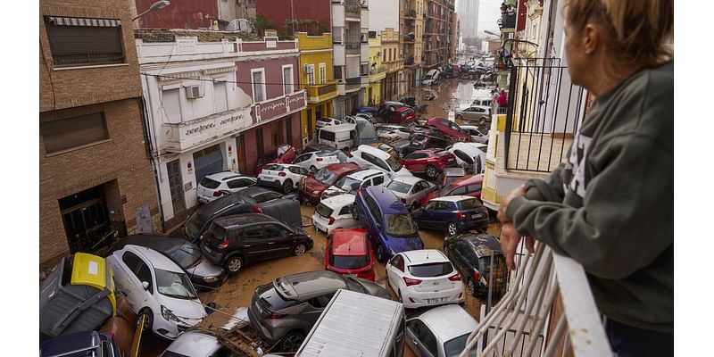 AP PHOTOS: Death by water, burial by mud. Images of Spain’s floods of the century