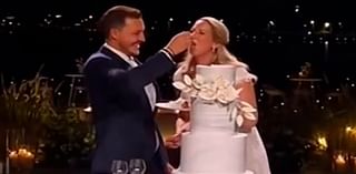 Sweet moment Princess Theodora of Greece and her LA-based lawyer husband slice into their four-tiered cake in front of royal wedding guests