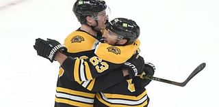 Brad Marchand scores OT goal to lead Bruins to 4-3 victory over Flames