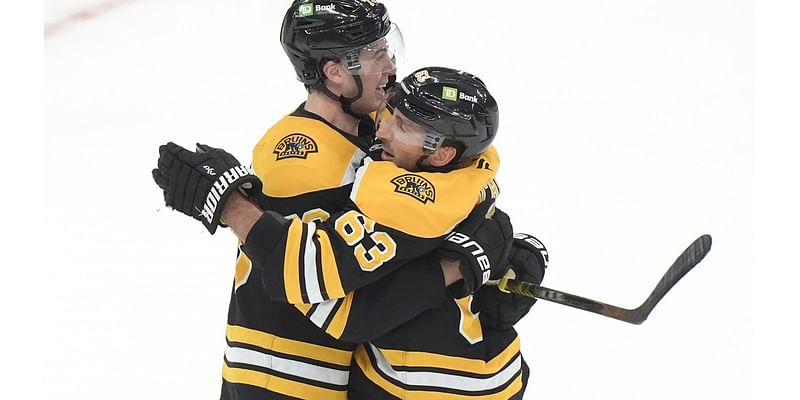 Brad Marchand scores OT goal to lead Bruins to 4-3 victory over Flames