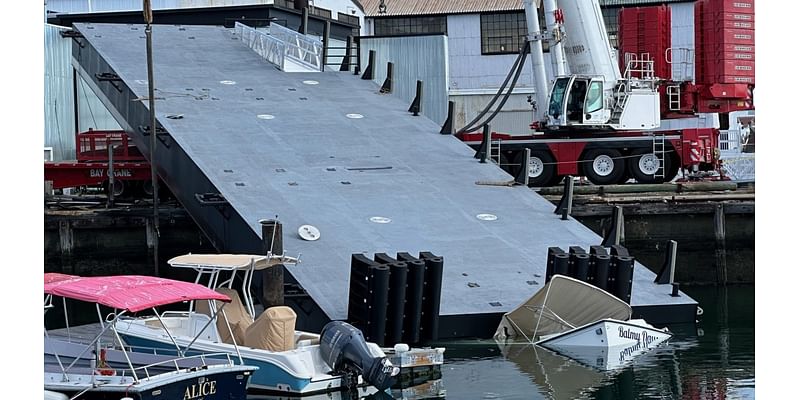 Crane collapse damages boat at marina in East Boston