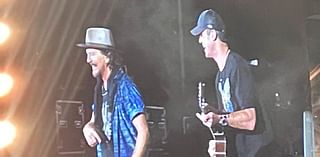 Pearl Jam frontman Eddie Vedder calls AFL legend onto stage during Melbourne show