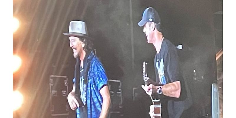 Pearl Jam frontman Eddie Vedder calls AFL legend onto stage during Melbourne show