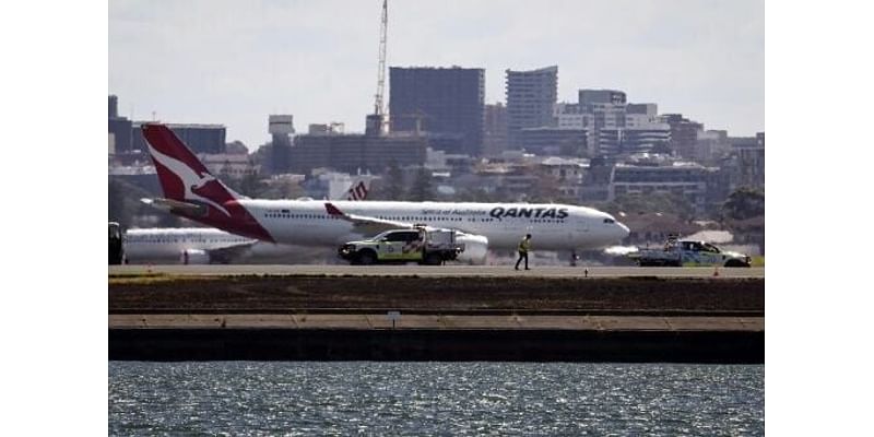 Qantas plane returns to Australia airport due to 'engine failure', sparks fire