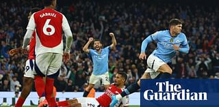 Stones rescues Manchester City with late equaliser against 10-man Arsenal