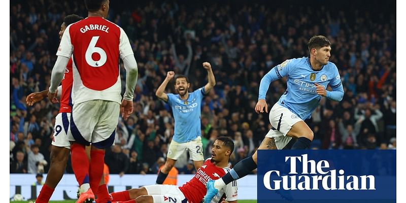 Stones rescues Manchester City with late equaliser against 10-man Arsenal