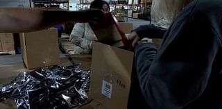 Wells Enterprises puts together 1,800 boxes of food