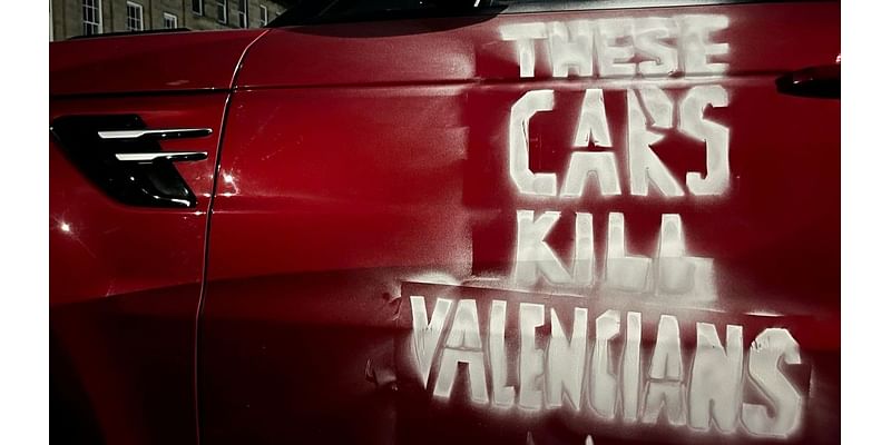 ‘These cars kill Valencians’: Climate activists target SUVs in solidarity with flood victims