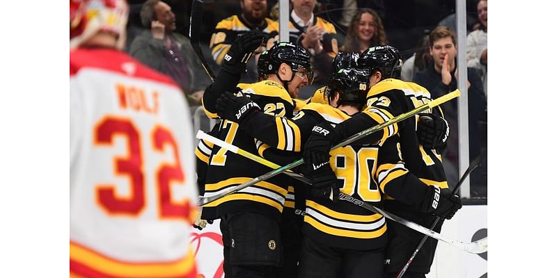 Flames force OT, but Brad Marchand wins it for Bruins