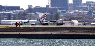 Qantas plane’s emergency landing sparks grassfire at airport after engine failure