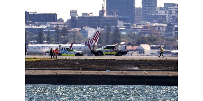 Qantas plane’s emergency landing sparks grassfire at airport after engine failure