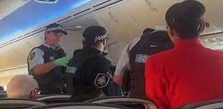 Drunken Jetstar passenger is kicked off the plane by cops after 'shouting racist abuse at flight staff'