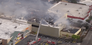 Firefight continues as "stubborn" fire burns at vacant building near West LA