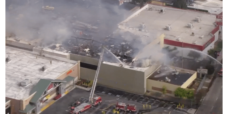 Firefight continues as "stubborn" fire burns at vacant building near West LA