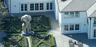 Aerial photos show Diddy's 20-foot statue memorializing Kim Porter and her 'little badonkadonk' at his Los Angeles mansion as he languishes in jail